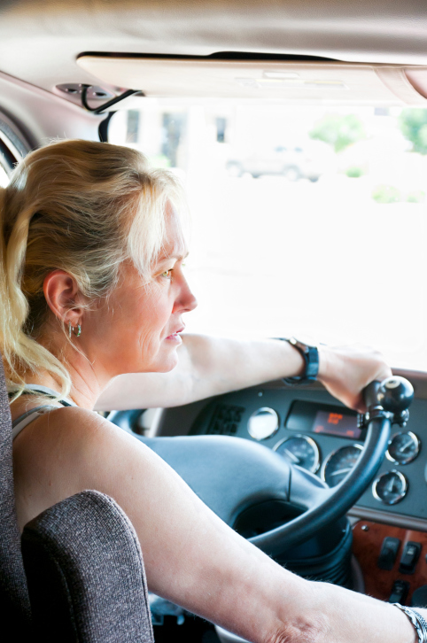 Female Trucker Driving A Semi-Truck Female Trucker Driving A Semi-Truck