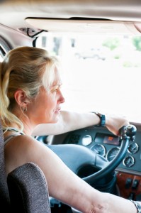 Female Trucker Driving A Semi-Truck